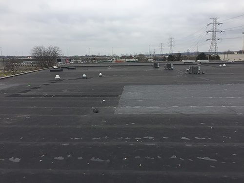 Gorilla Glue before a silicone roof coating system installed