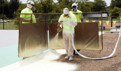 windscreen being used to prevent overspray when installing spray foam roofing