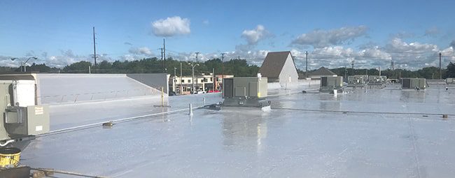 silicone roof coating on a commercial roof