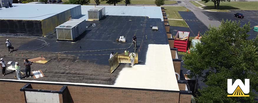 spray foam installed over a gravel roof