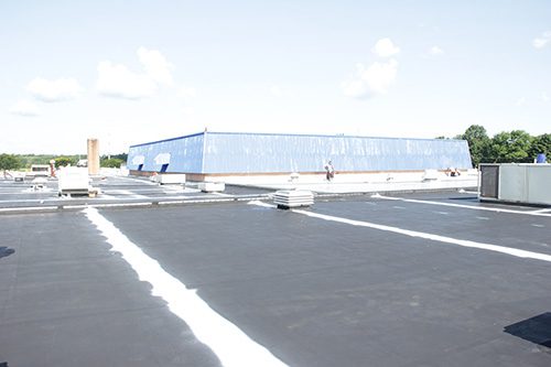 seam treatment on a silicone roof coating system on an EPDM roof
