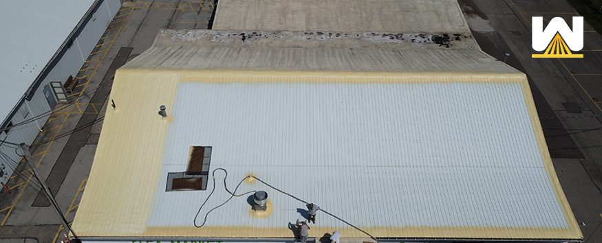 metal roof being restored with spray foam