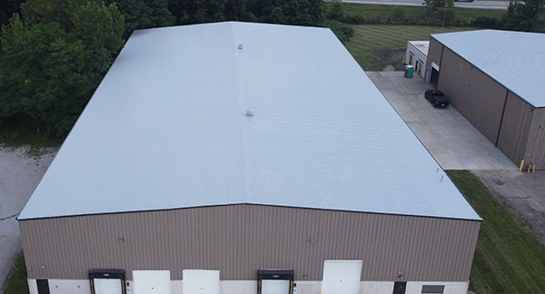 metal roof restored with roof coating system