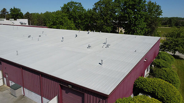 spray foam roofing system over an existing metal roof