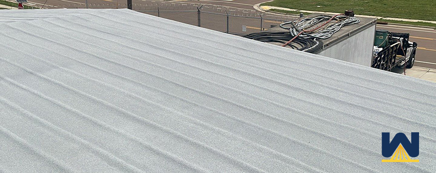 restoring commercial metal roof with spray foam