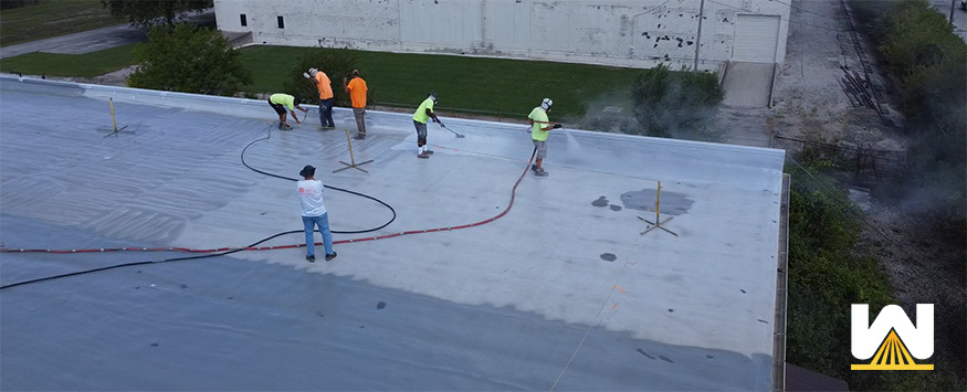 commercial roofing trends - installing renewable coating systems