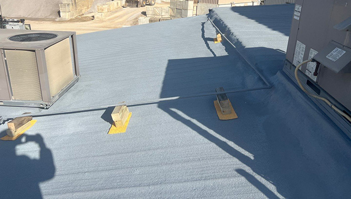 Finished spray foam roof over an existing metal roof