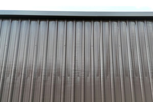 Silicone coating added to vertical metal wall panels