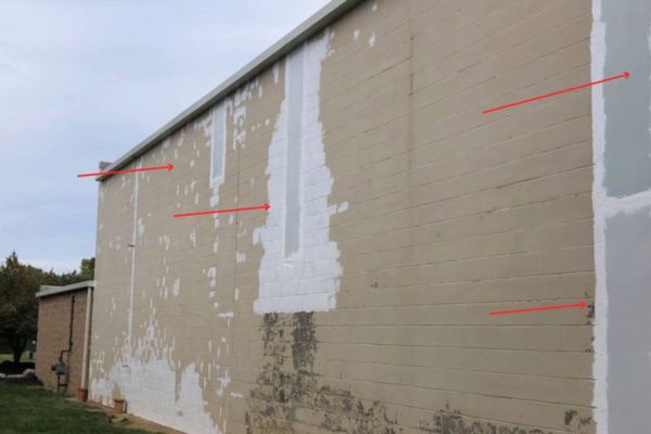 large sheets of metal inserted into exterior wall, then coated