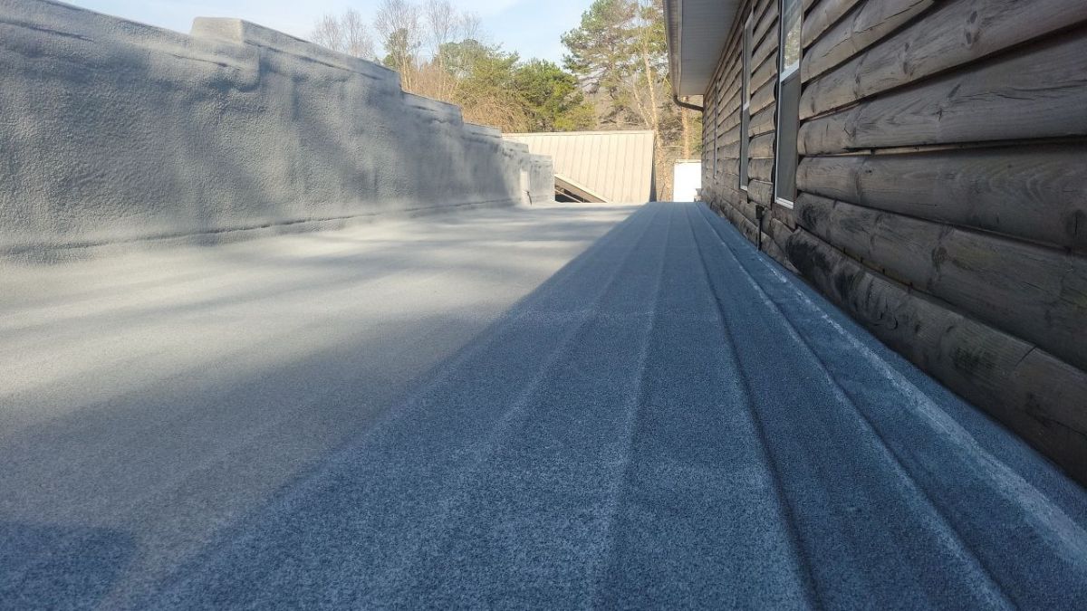 Finished roof at Landmark Recovery after coating and granule embedment