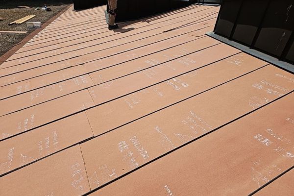 Plywood used a flute fill into metal panels before spray foam gets installed