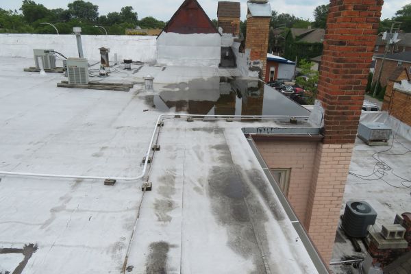 Maryland Court smooth BUR roof before restoration