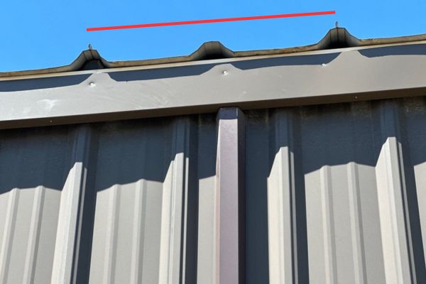 Tubular Steel roof before spray foam, showing deep metal panel trapezoids