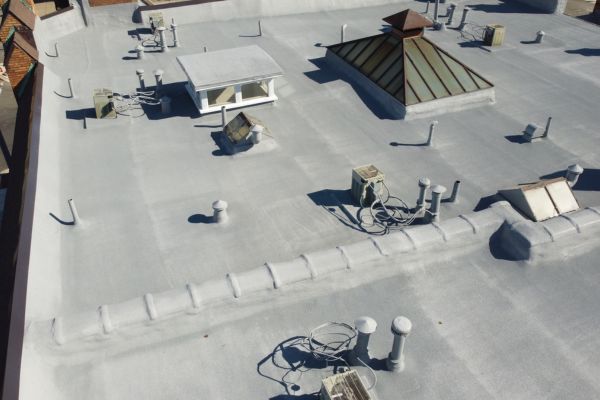 Finished spray foam and silicone coated roof at Maryland Court