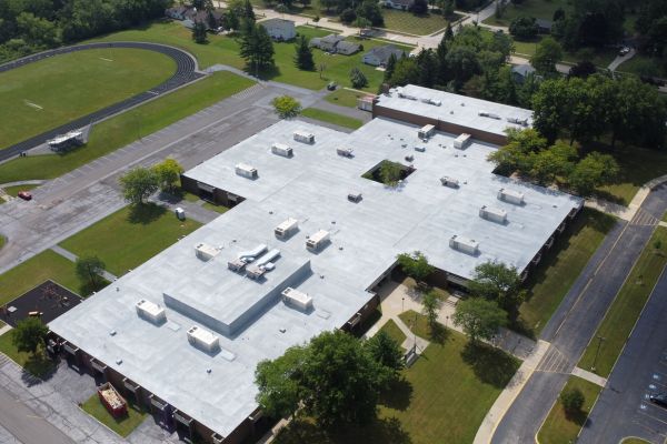 Spray polyurethane foam roofing system installed over gravel built up roof at Heskett Middle School in Bedford Heights, Ohio