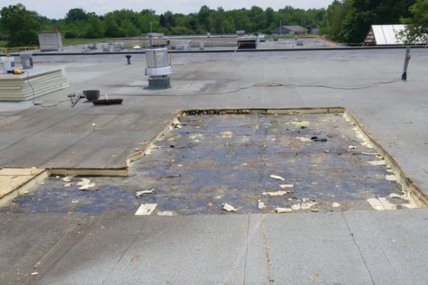 Before image of Mercer County Career Center's roof. Wet insulation has been removed. 