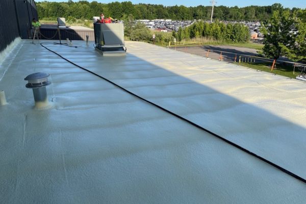 spray foam roofing installed over plywood and metal roof