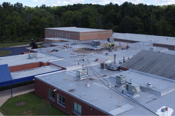Metzenbaum Center roof before restoration showing aging materials that need removed and replaced.