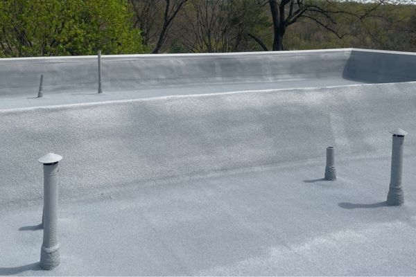 Finished spray foam roof over mod-bit at Granger Lakes condos