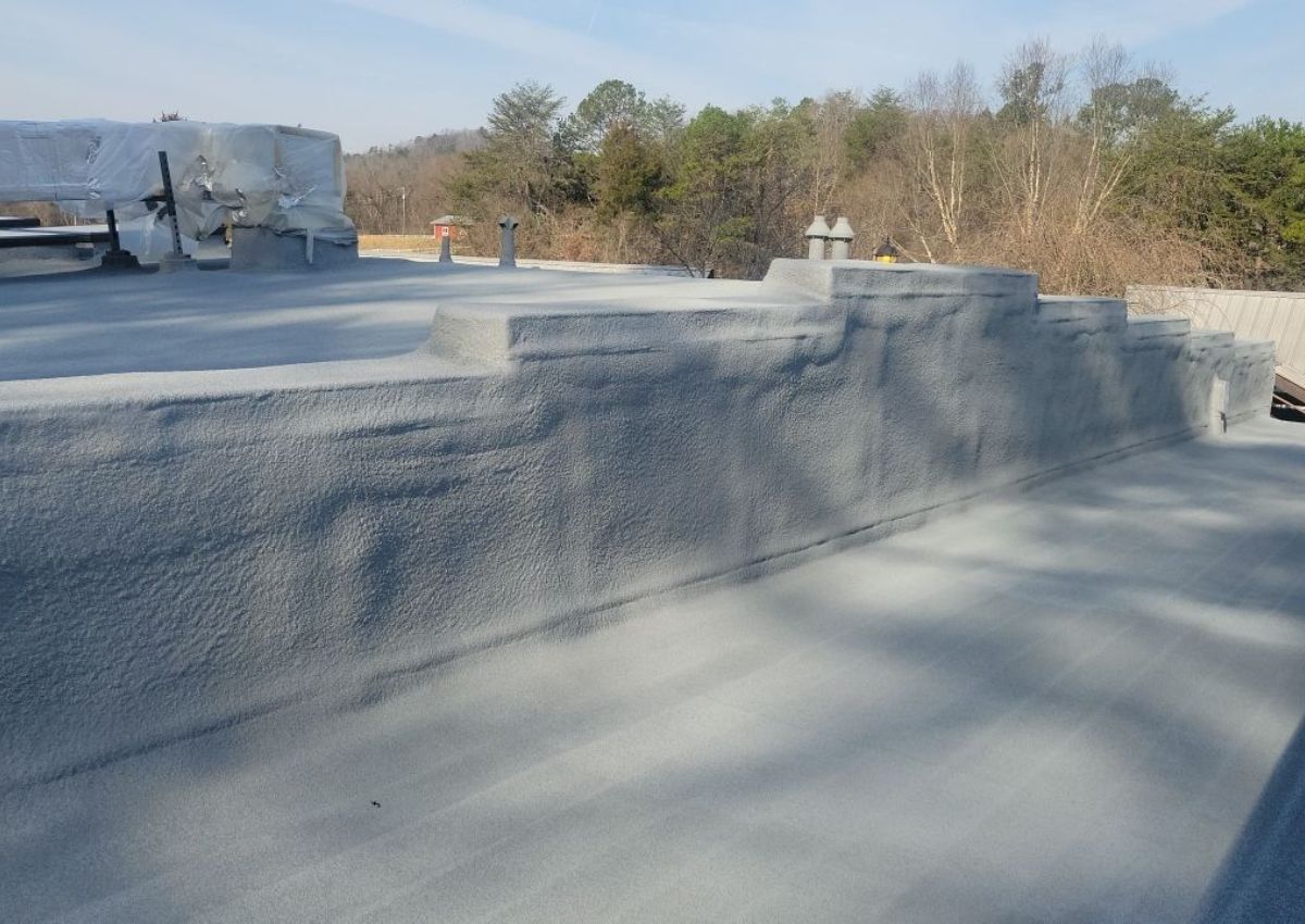 Spray foam installed up and over vertical walls