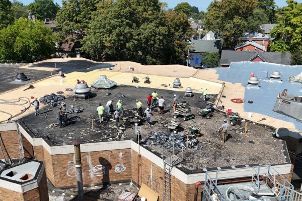 This existing Gravel Built-Up roof in Cleveland, Ohio needs to be 100% torn off. In 2025, a spray foam roof was installed.
