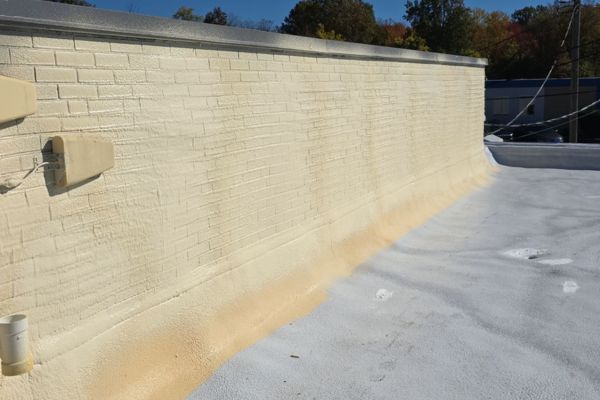 A spray foam roof installed in 2025 in Warrensville Heights, Ohio. The existing roof was a Smooth Built-Up.