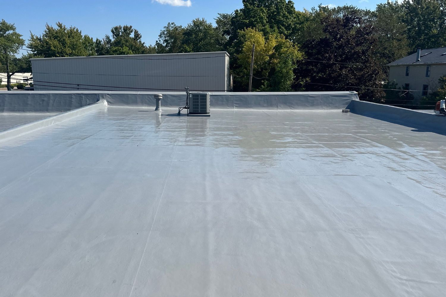 Existing PVC roof is restored with a silicone roof coating system