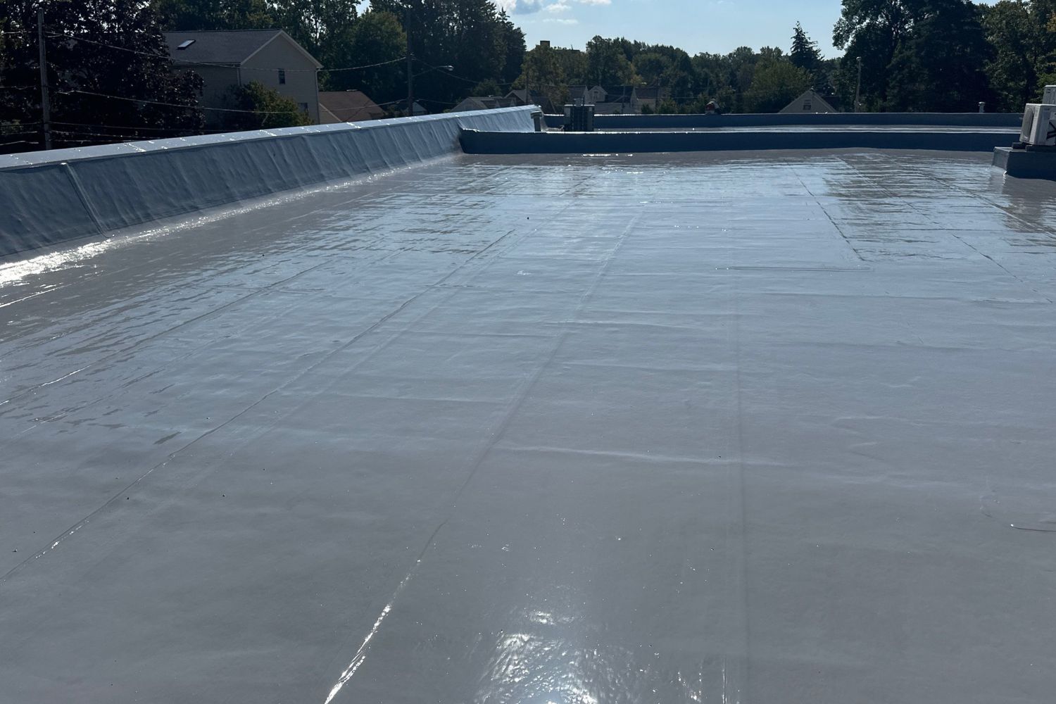 Silicone roof coating system over an existing PVC roof