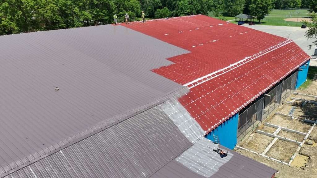In-progress silicone roof coating project at Elyria Ice Rink in 2025.