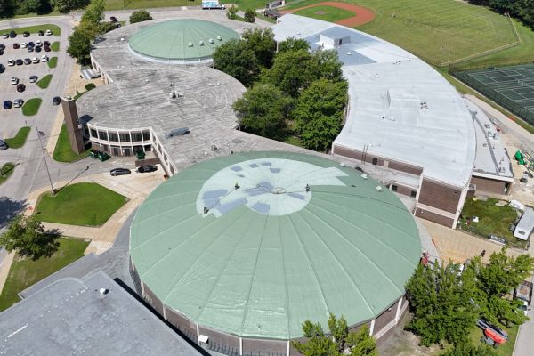 In-progress photo of a spray foam recoat being installed at Normandy High School and Domes in 2025
