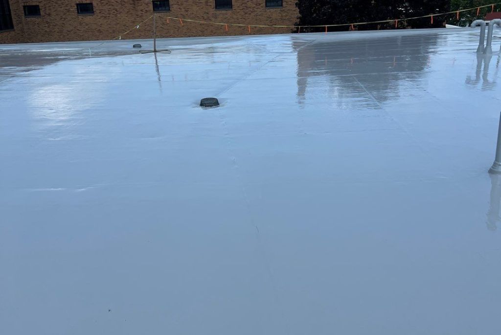 Finished photo of a silicone roof coating system restoring a school roof in Cleveland, Ohio