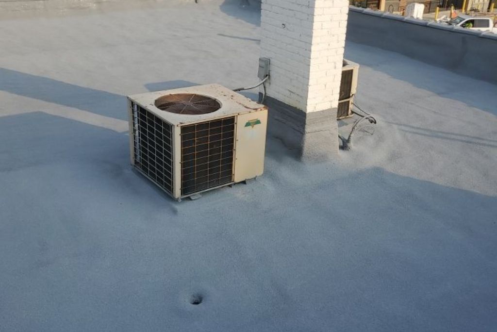 Commercial Roofing Project Completed in Lakewood Ohio - Spray Foam over a Smooth Built-Up Roof