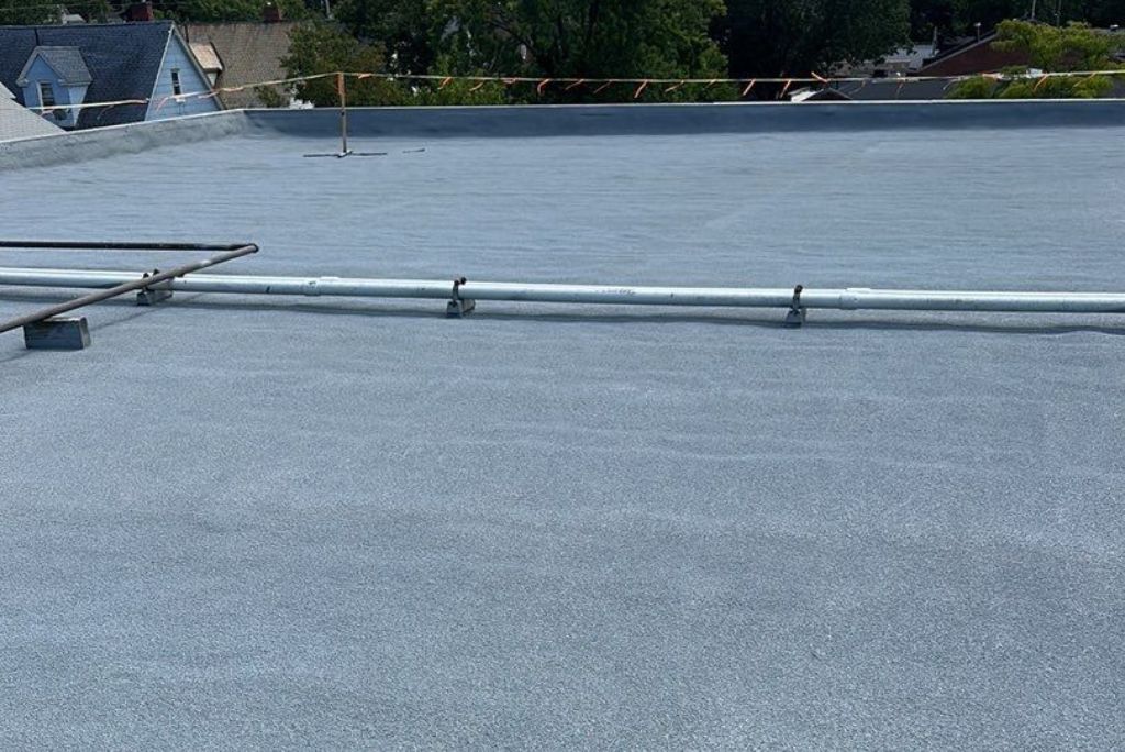 Commercial Roofing Project Completed in Lakewood Ohio - Spray foam over Smooth Built up - By West Roofing Systems