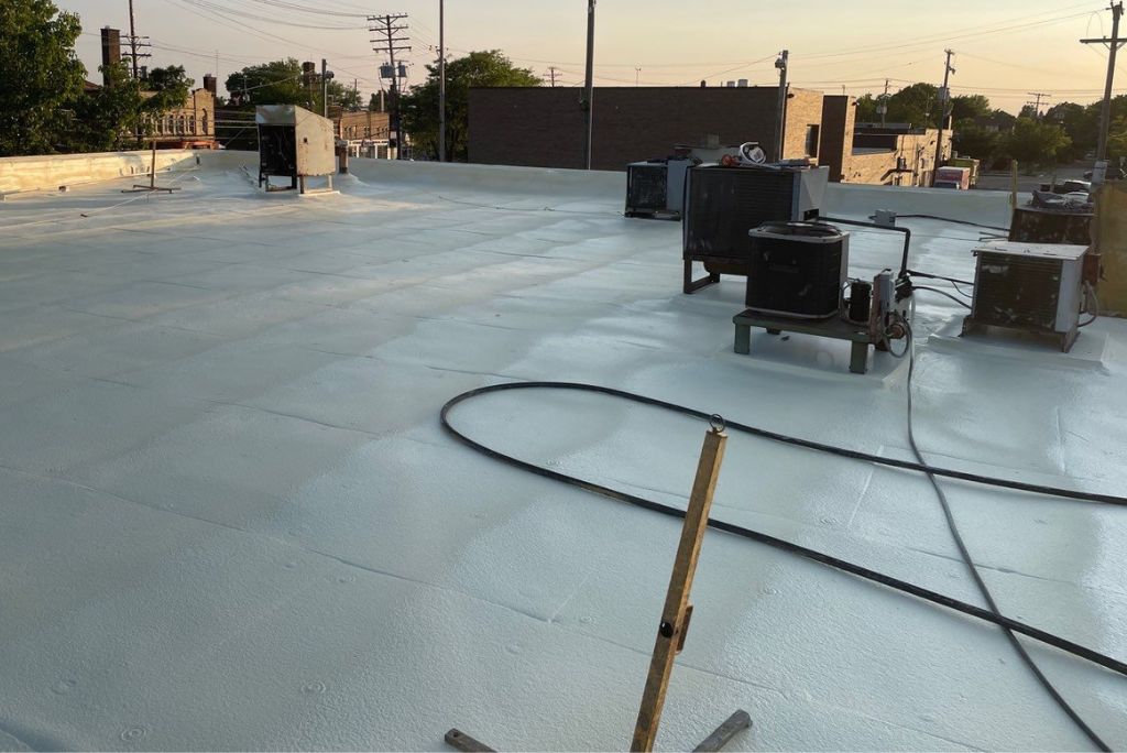 commercial roof installed in cleveland ohio - spray foam over smooth modified bitumen
