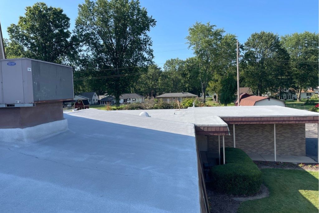A commercial roof in Elyria has been repaired with spray foam and silicone roof coatings