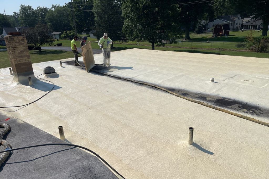 An existing Church roof is being repaired with spray foam roofing and coating