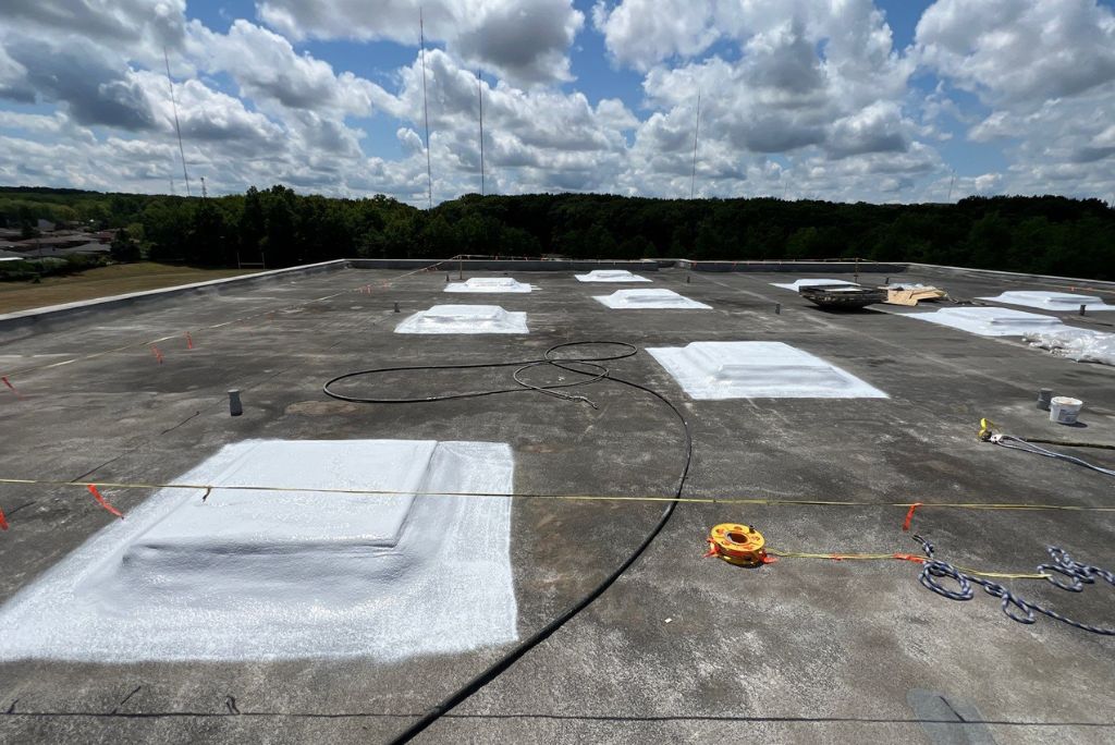 Recoating a Commercial Roof in Parma, Ohio - Shiloh Middle School - done by West Roofing Systems