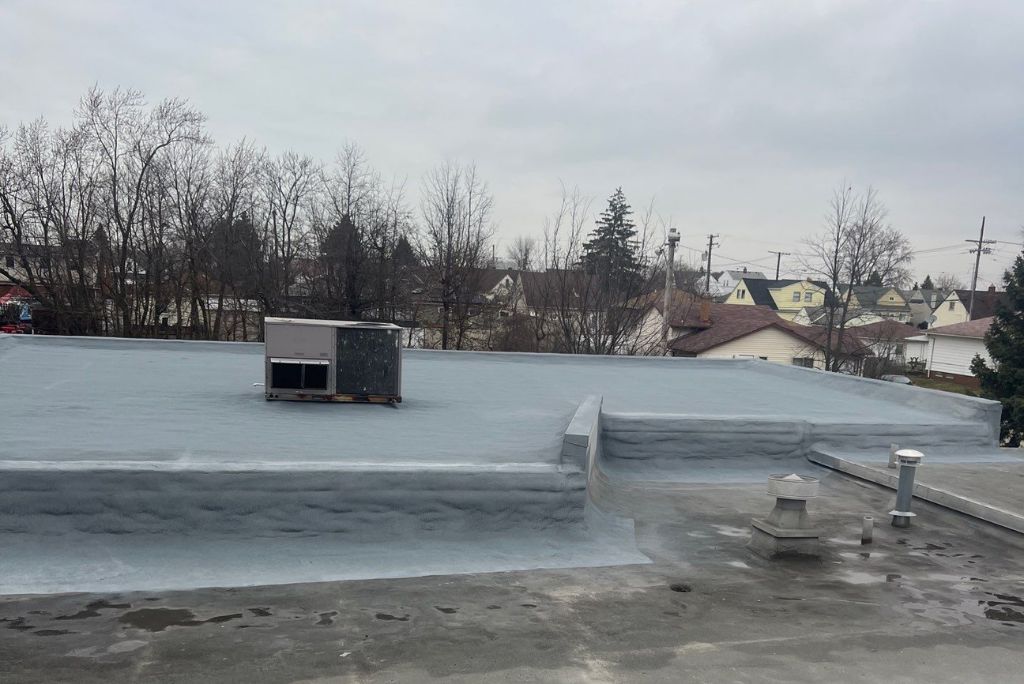 Spray Foam Recoat on Commercial Roof in Parma Ohio - Ridgebrook Elementary